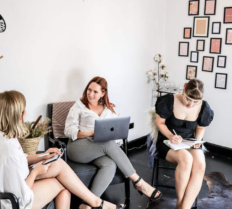 A group of women planning a business together.