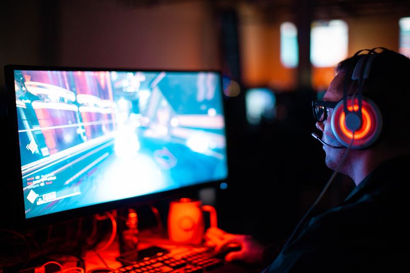 A man playing a desktop video game