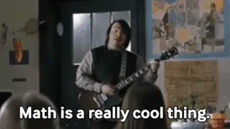 Jack Black playing guitar in a classroom. He sings, 