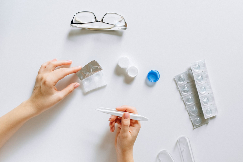 A person preparing contact lenses