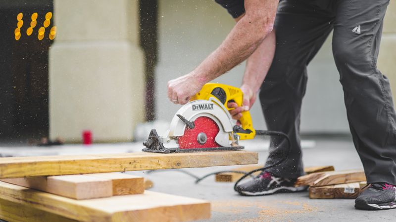 Carpenter using a power saw