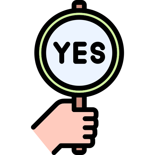 A hand holding up a sign saying "yes".
