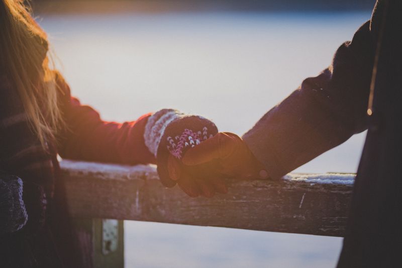 Two people holding hands