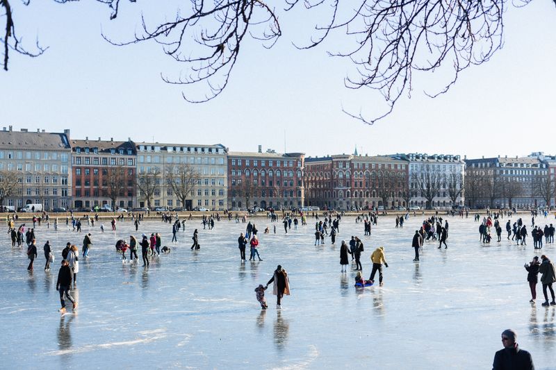 People are ice skating outdoors