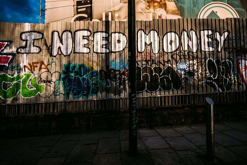 Graffiti on a fence that says 