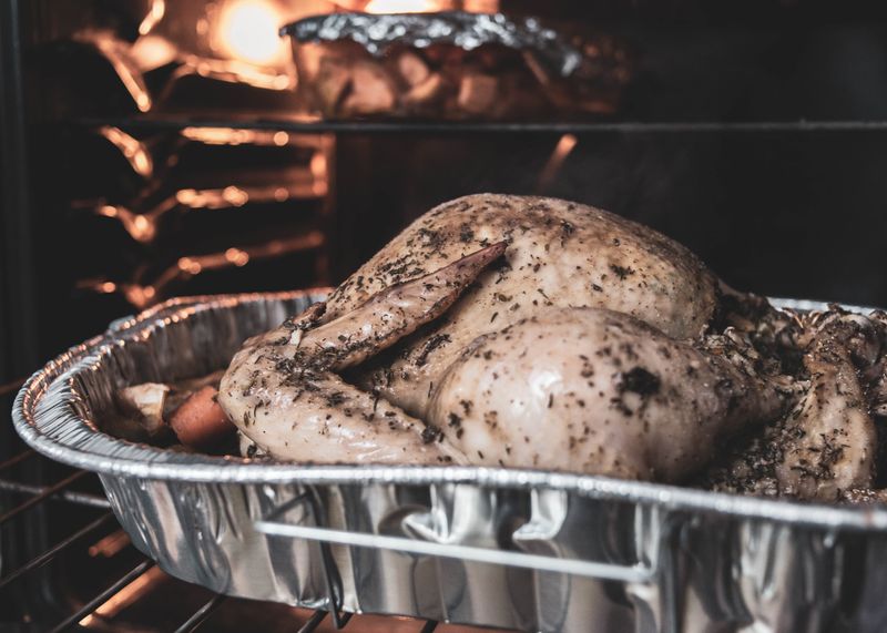 Roasting a turkey in the oven (Photo by Jonathan Cooper on Unsplash)