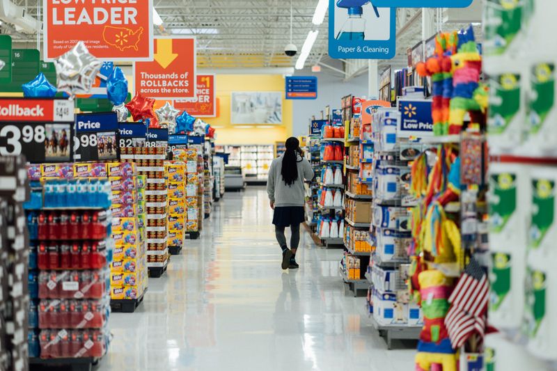 Image of a supermarket aisle with products on either side.