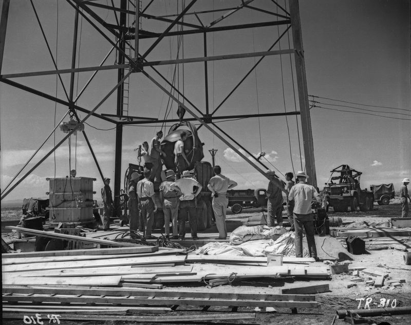 A group of atomic scientists preparing to test a nuclear bomb at Los Alamos.