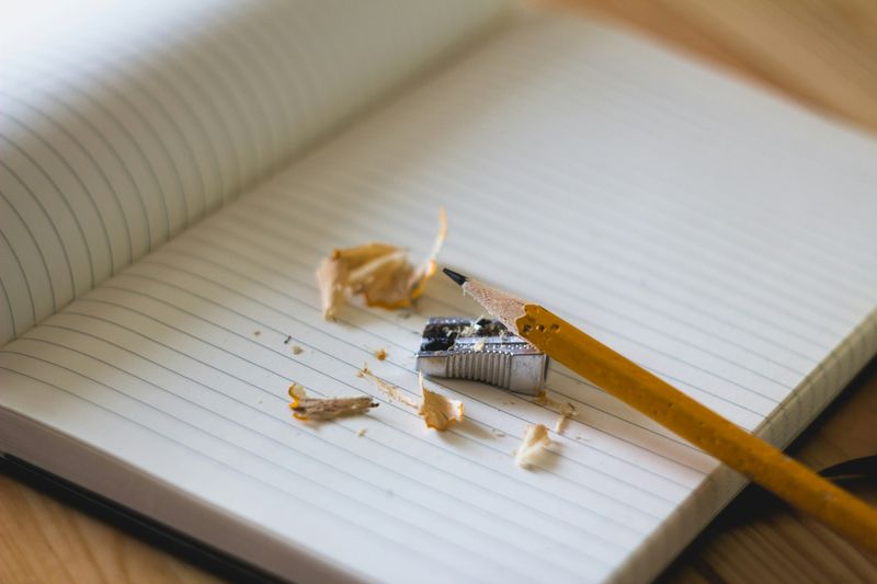 A journal with pencil and pencil sharpener.