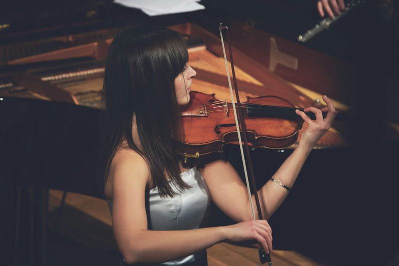 A violinist playing at a concert.