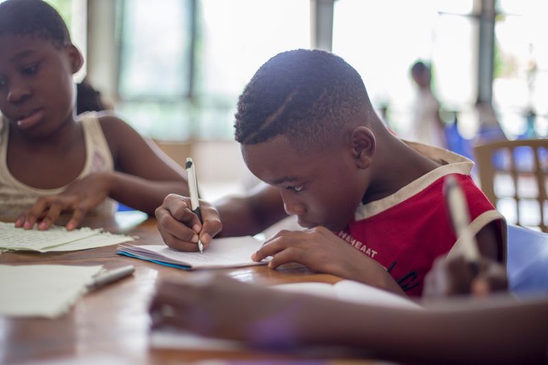 Two students learning at their desks.