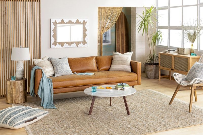 A jute rug on a large living room floor.