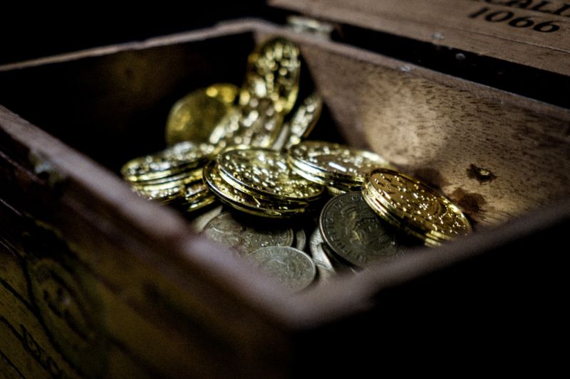 An open chest with golden coins inside.