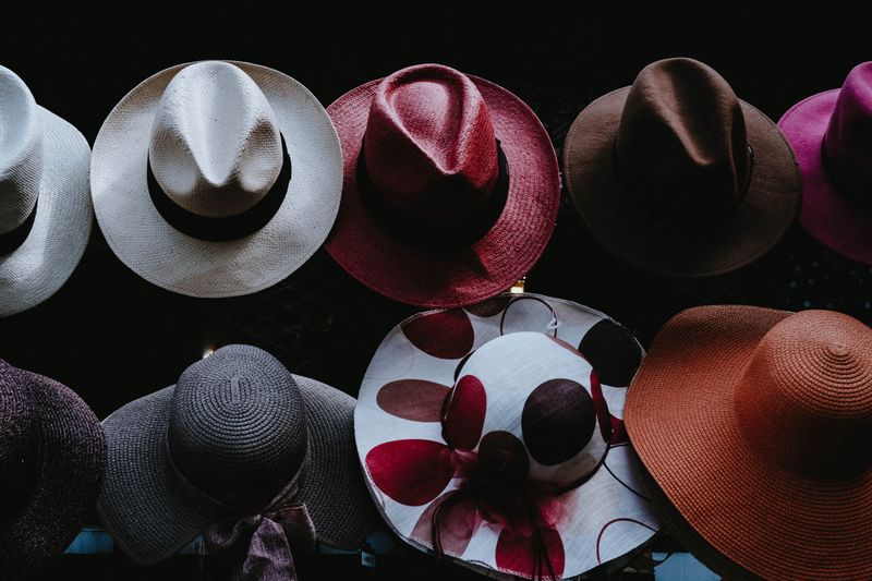 A variety of hat styles and colors.