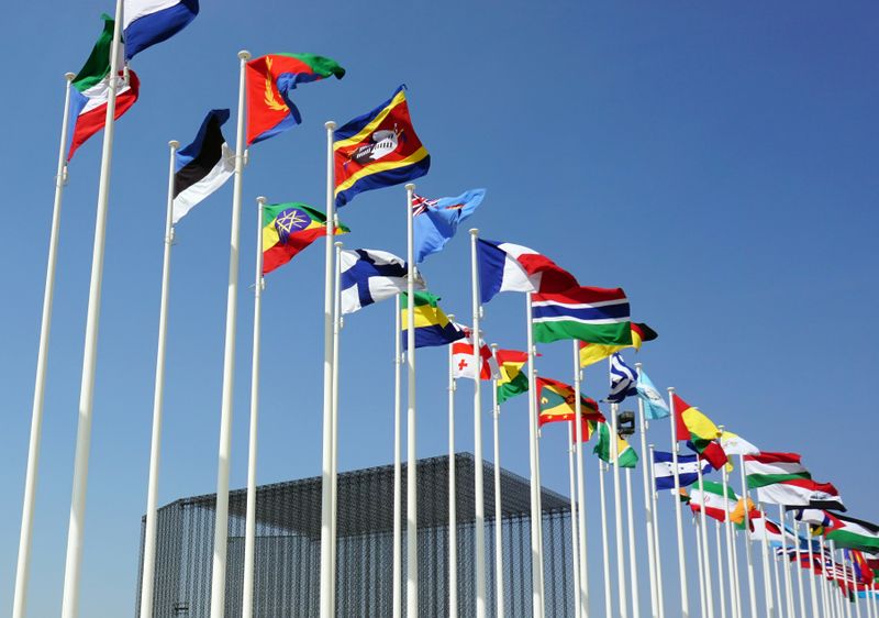 A long line of flags from different nations.