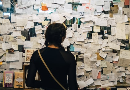 student looking at a board of notes