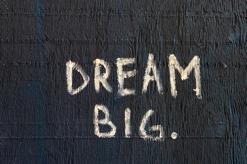 Dark wall with the words 'Dream Big.' written in the center.