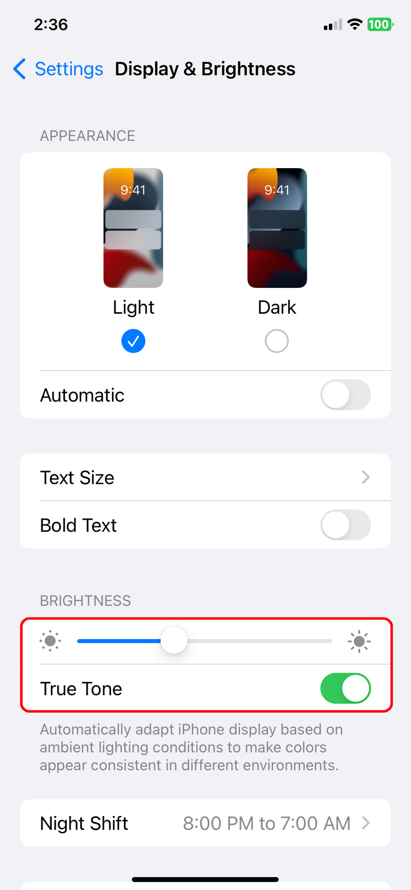 iPhone Display & Brightness slider highlighted in Settings.