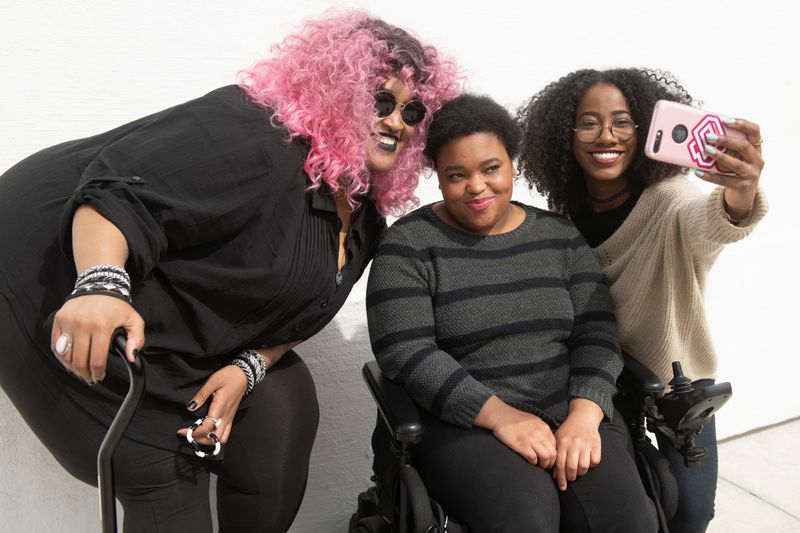 A group of disabled people posing for a picture.