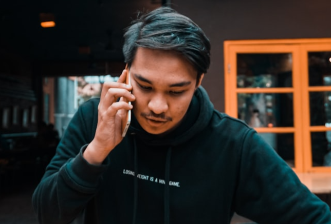 Image of a man talking on the phone