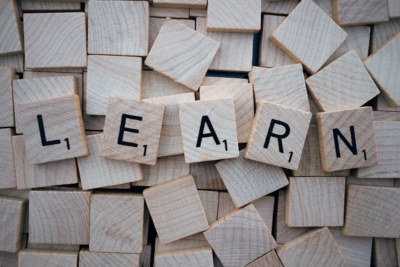 Scrabble tiles that spell the word 'Learn'