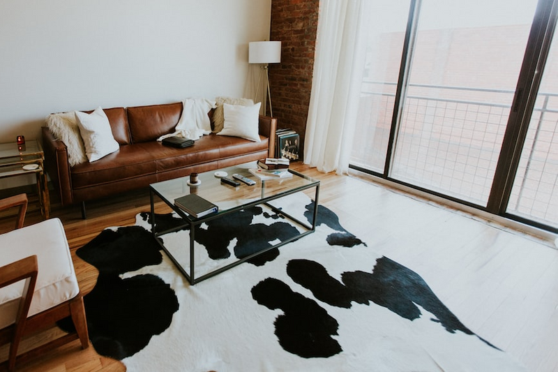 A cowhide rug in a living room