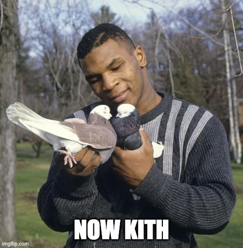 Mike Tyson with two birds close to touching beaks and says 