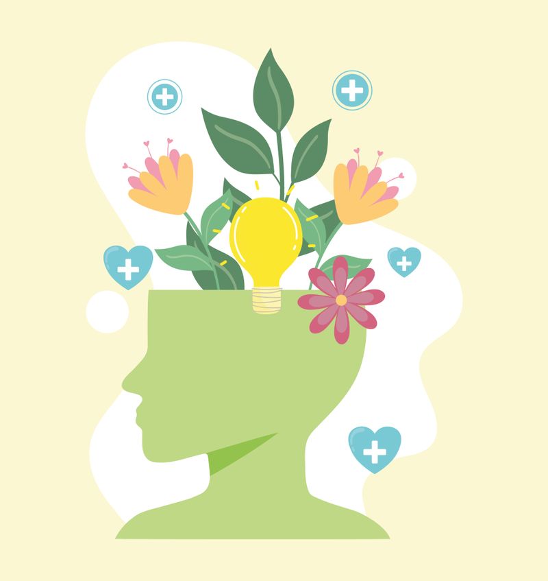 An illustration of a human head with flowers to represent mental health