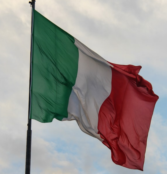 The Italian flag waving in the wind.