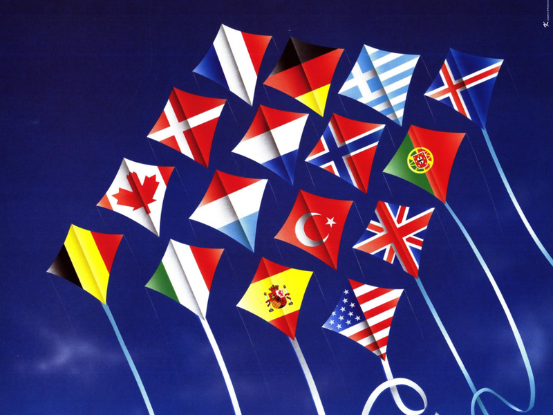 A NATO poster depicting a series of flags of member countries as kites flying in the sky.