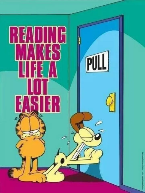 Cartoon dog is 'pushing' to open a door marked 'pull' and a cat responds: 'reading makes life a lot easier'  