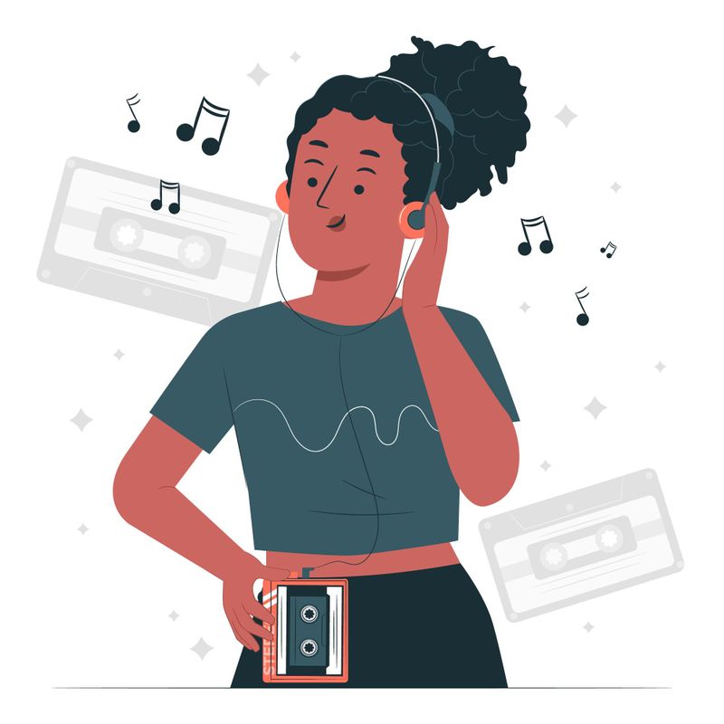 Feminine-presenting person with dark melanin skin listening to cassette player music with headphones and wearing crop top.