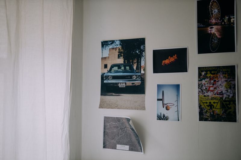 Wall with several posters on it