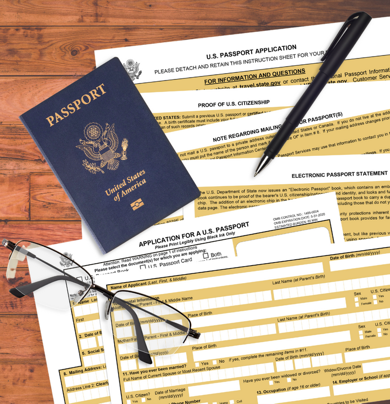 US passport, eyeglasses, and a black pen on US passport application