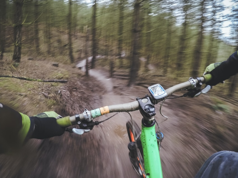 A person riding down a mountain path