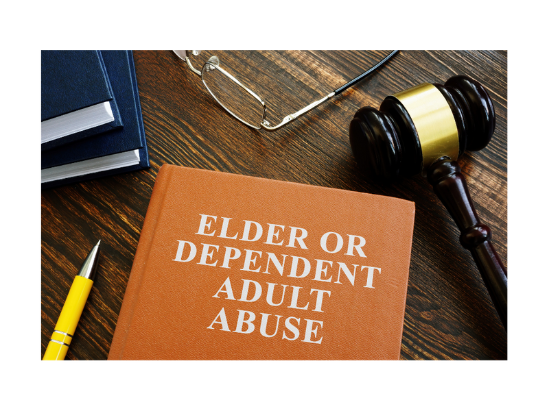 A book titled Elder or Dependent Adult Abuse on a table with a gavel, pen, additional books, and eyeglases.