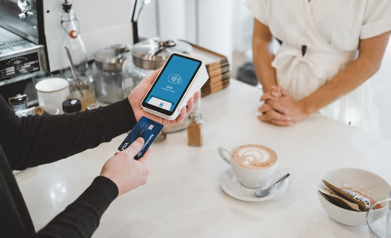 cashier handling a credit card payment