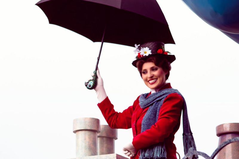 Mary Poppins holding an umbrella