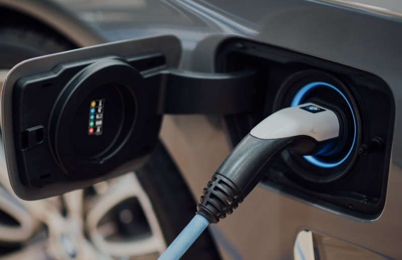 A charger in an electric car's charging port.