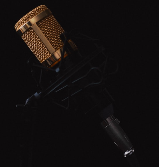 A microphone in a dark room.