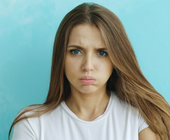 Picture of a girl looking angry.