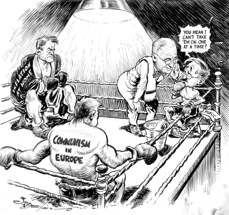 A political cartoon depicting President Truman attempting to fight communism in Europe and US inflation.