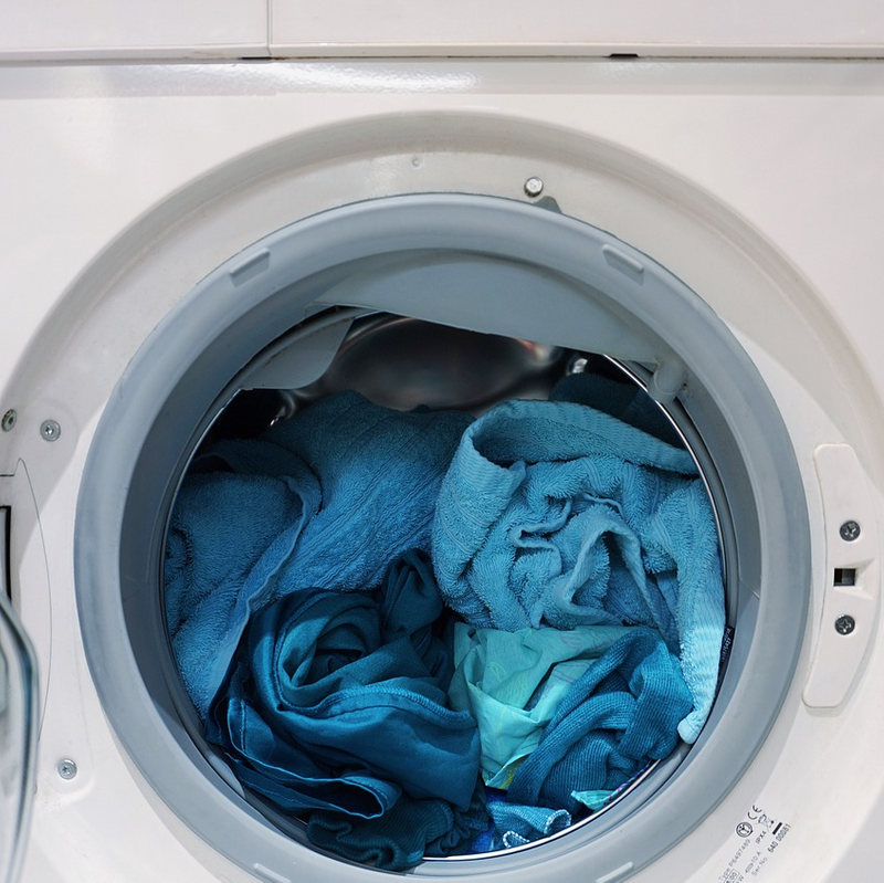 Towels in a front-loading washing machine.