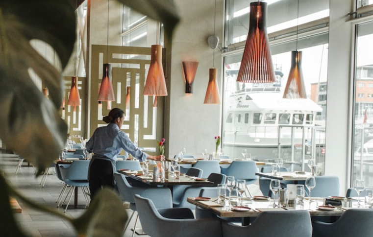 A person working at a table in a restaurant.