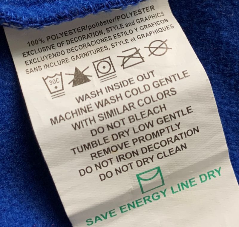 Laundry tag: wash inside out, machine wash cold gentle, do not bleach, tumble dry low gentle, save energy line dry