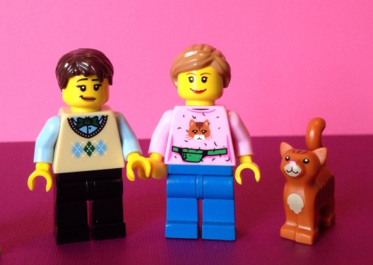 Two women lego characters with a cat