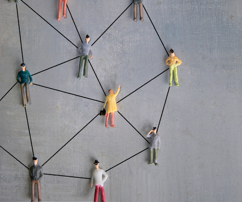 Small figures connected by lines, representing professional networking.
