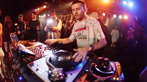 DJ mixing music on turn table.