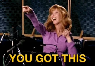 Lisa Kudrow in a recording studio. She dances and says, 