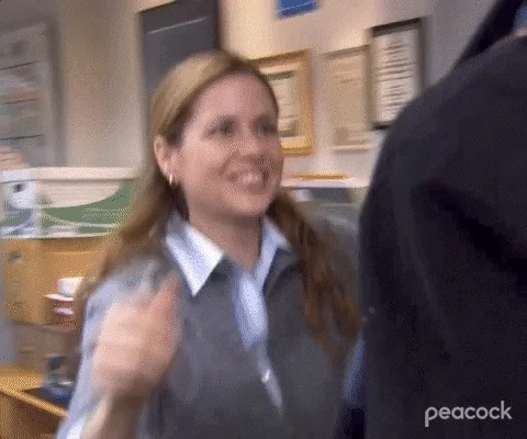 Jim and Pam from The Office hugging.